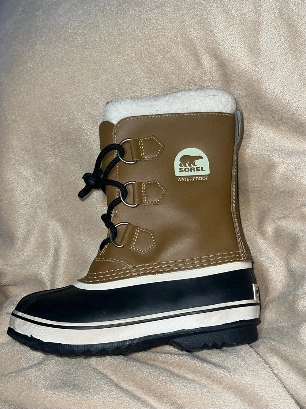 Sorel kids Tan and Black Waterproof Snow Boot with White Fleece Cuff- size 1